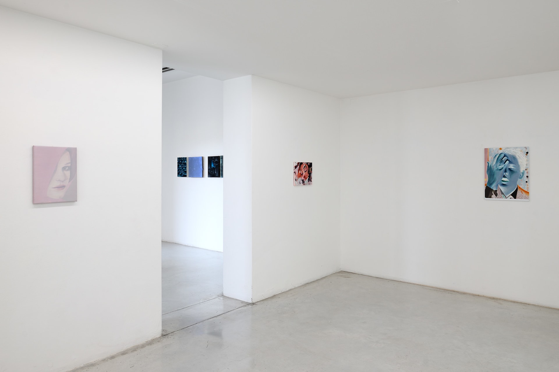 Workplace's booth at Hit! Micro Fair in Verona, Italy with paintings by Katinka Lampe, Laura Lancaster, Rachel Lancaster and Robin Megannity.