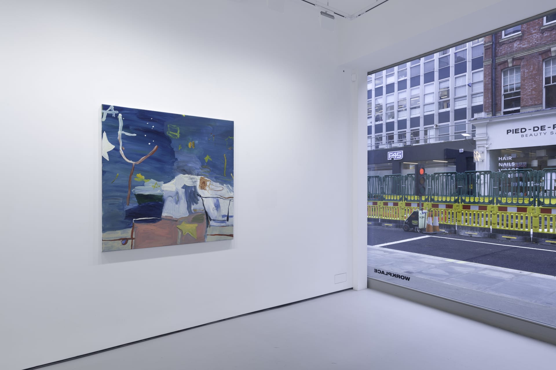 A white walled gallery with 4 artworks by b chehayeb hung on the walls