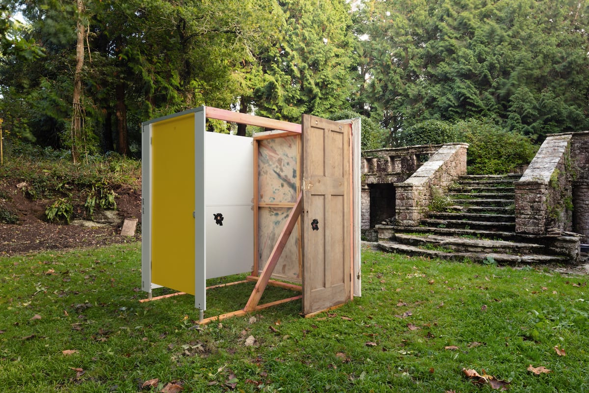 Abstract yellow painting by James Cabaniuk  Installed with a toilet cubicle, gaffer tape, Edwardian door and timber structure