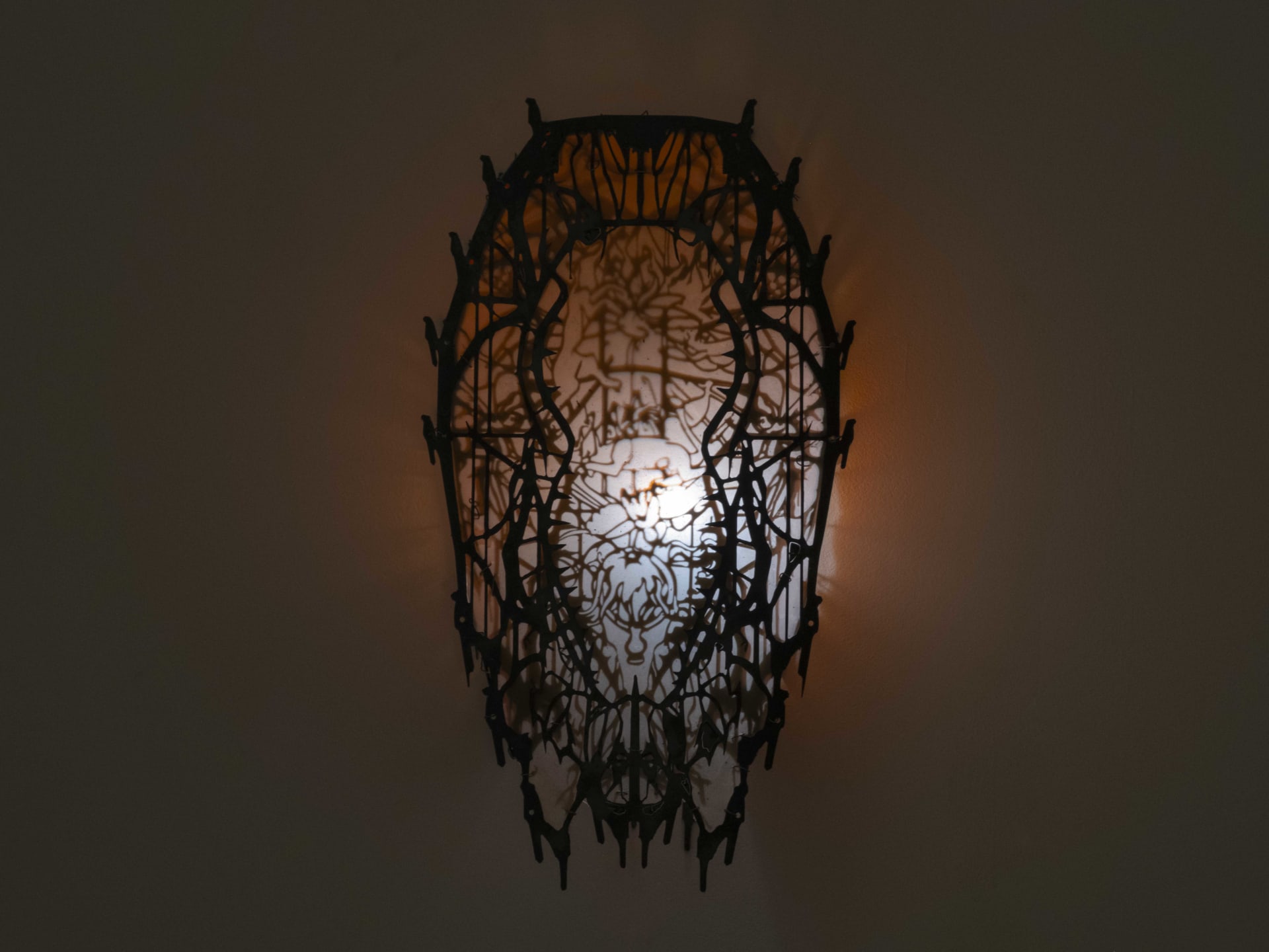 Wall sculpture by Hazel Brill made of a metal frame and latex skin and lit from the inside with a dim white light. Gothic in style.