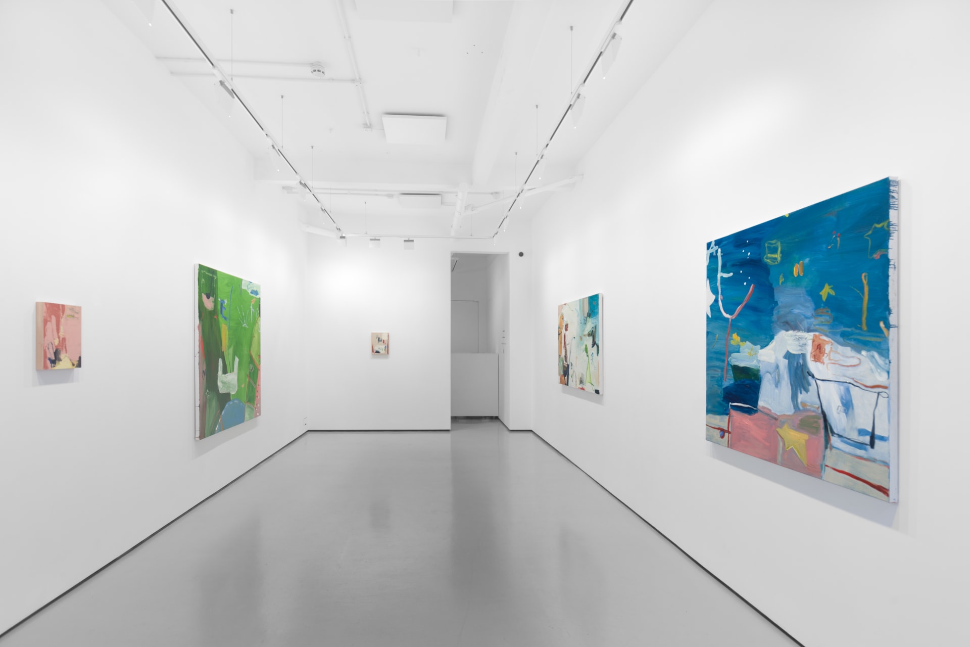 A white walled gallery with 4 artworks by b chehayeb hung on the walls