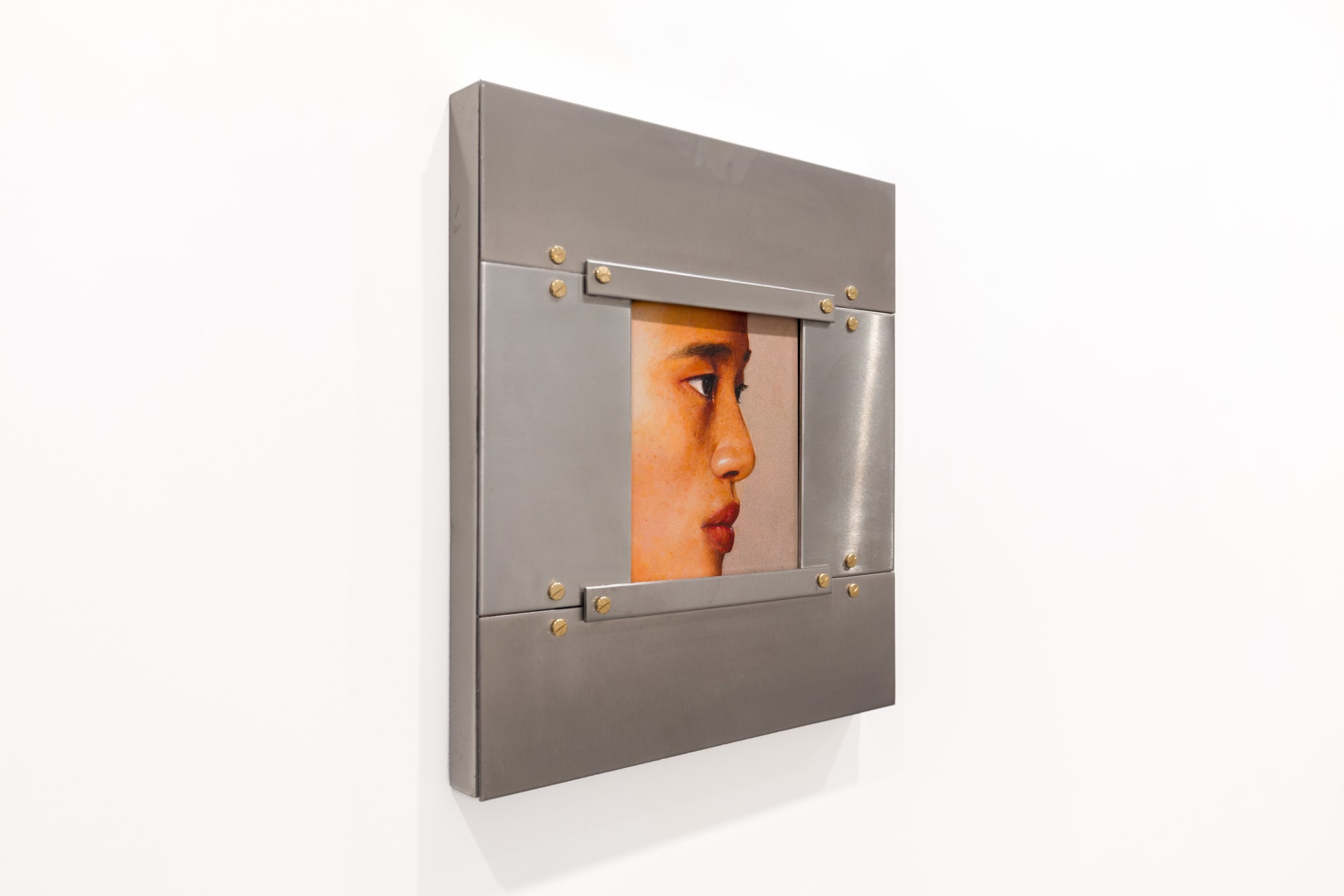 A painting by Ki Yoong of the side profile of a young man's face