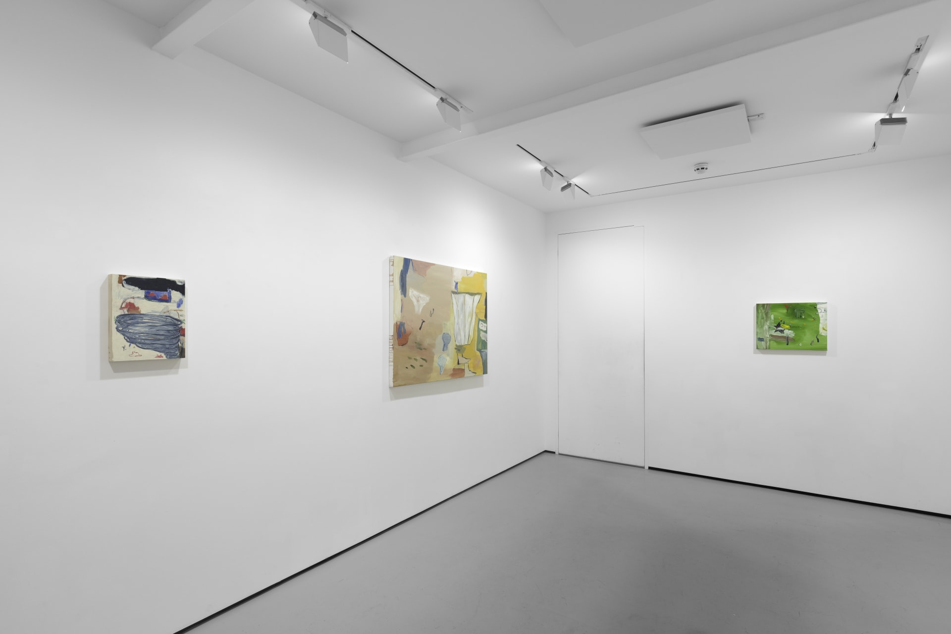 A white walled gallery with 4 artworks by b chehayeb hung on the walls