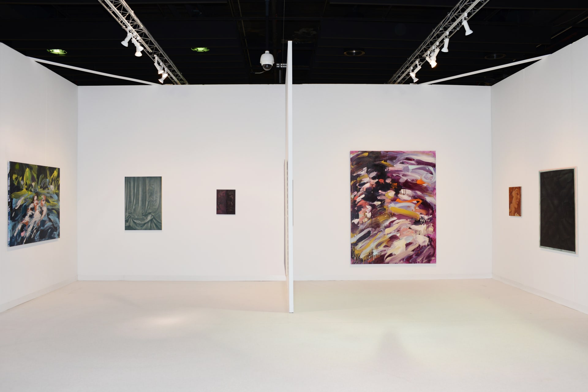 Workplace's booth at The Armory Show in 2020 featuring paintings by Laura Lancaster and Louise Giovanelli