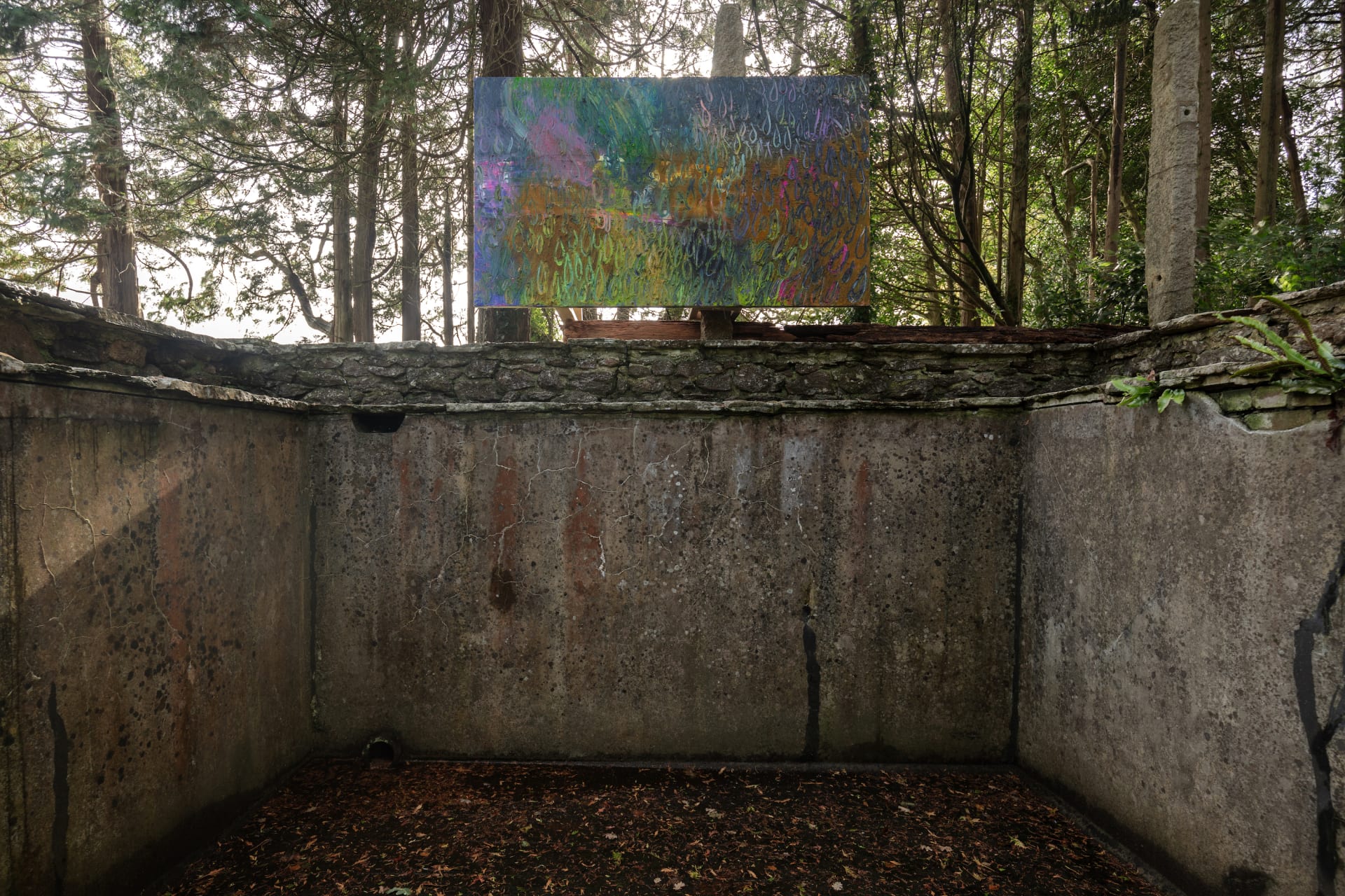 Artworks by James Cabaniuk installed outside in a lush green garden