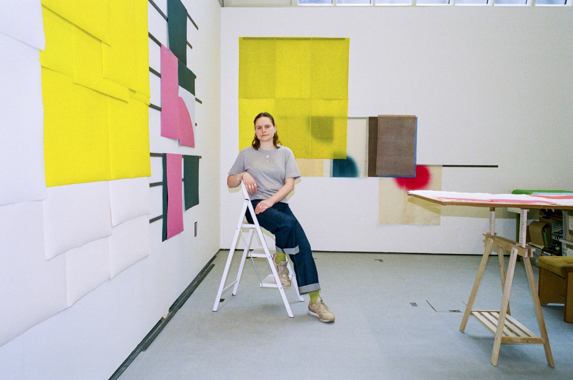 A portrait of Lizzie Munn sat in her studio