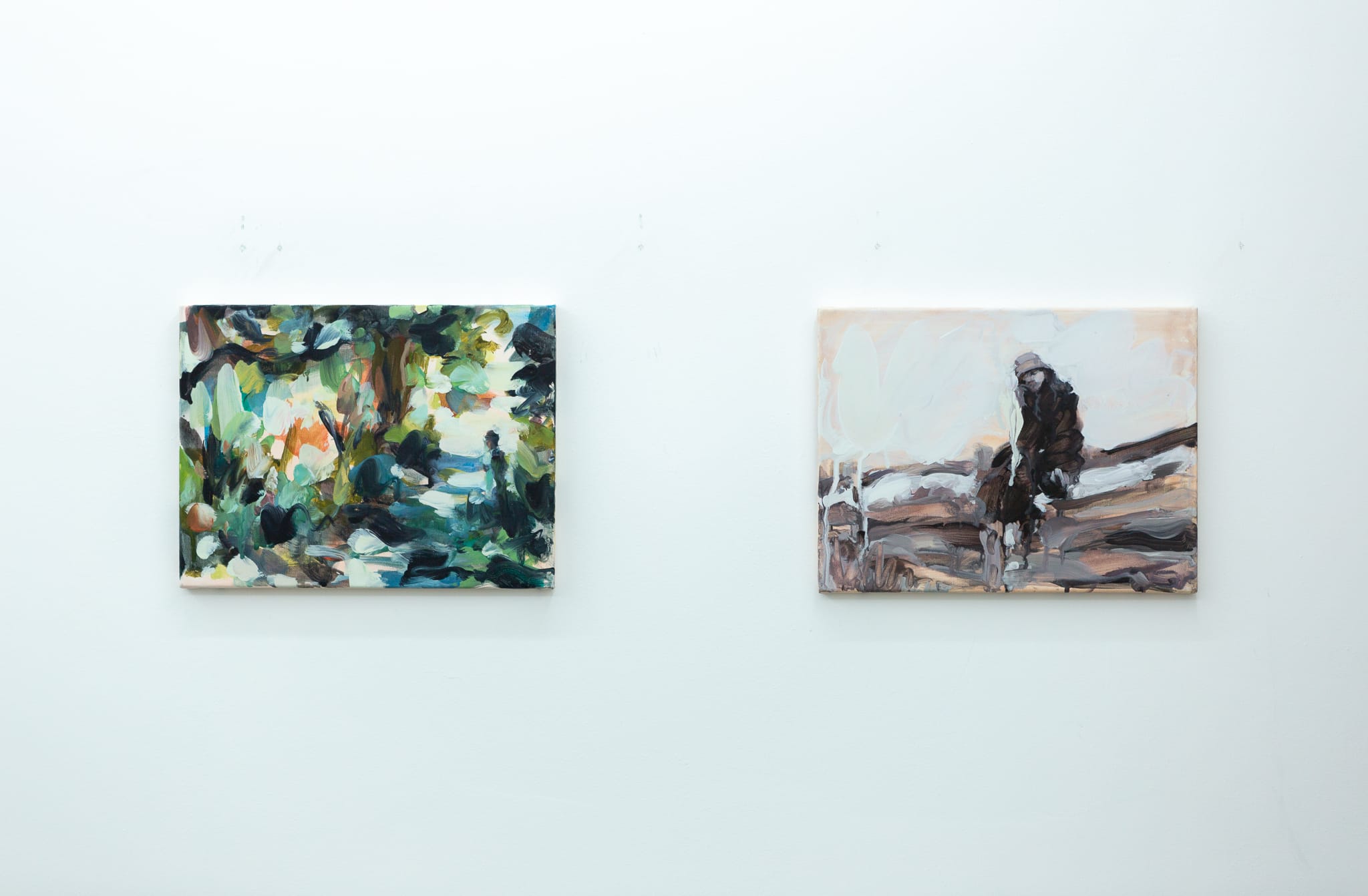 Installation shots of Laura Lancaster's solo show at Workplace London. Close up crop paintings of sleeping women and figures in landscapes, loosely painted.