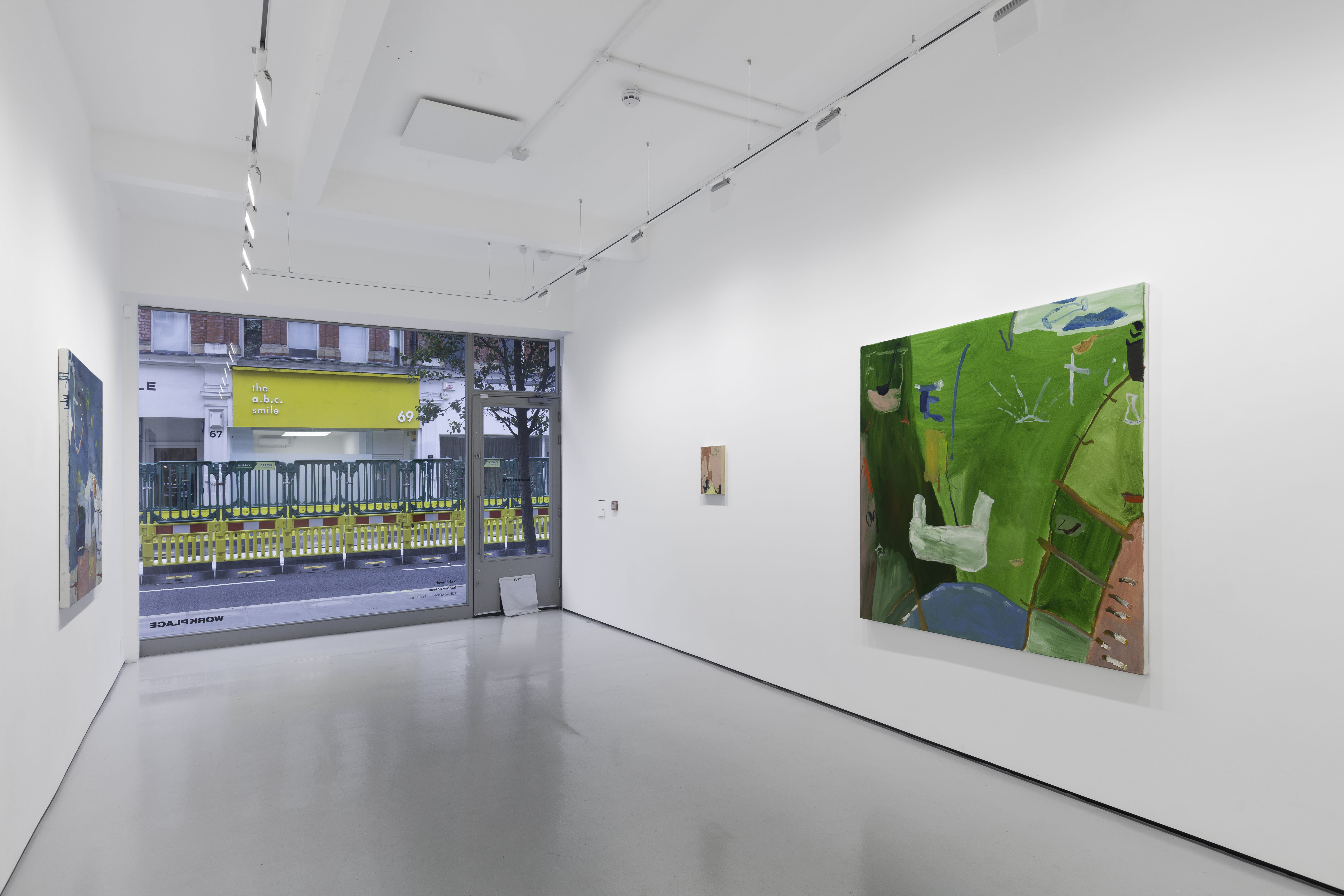 A white walled gallery with 4 artworks by b chehayeb hung on the walls
