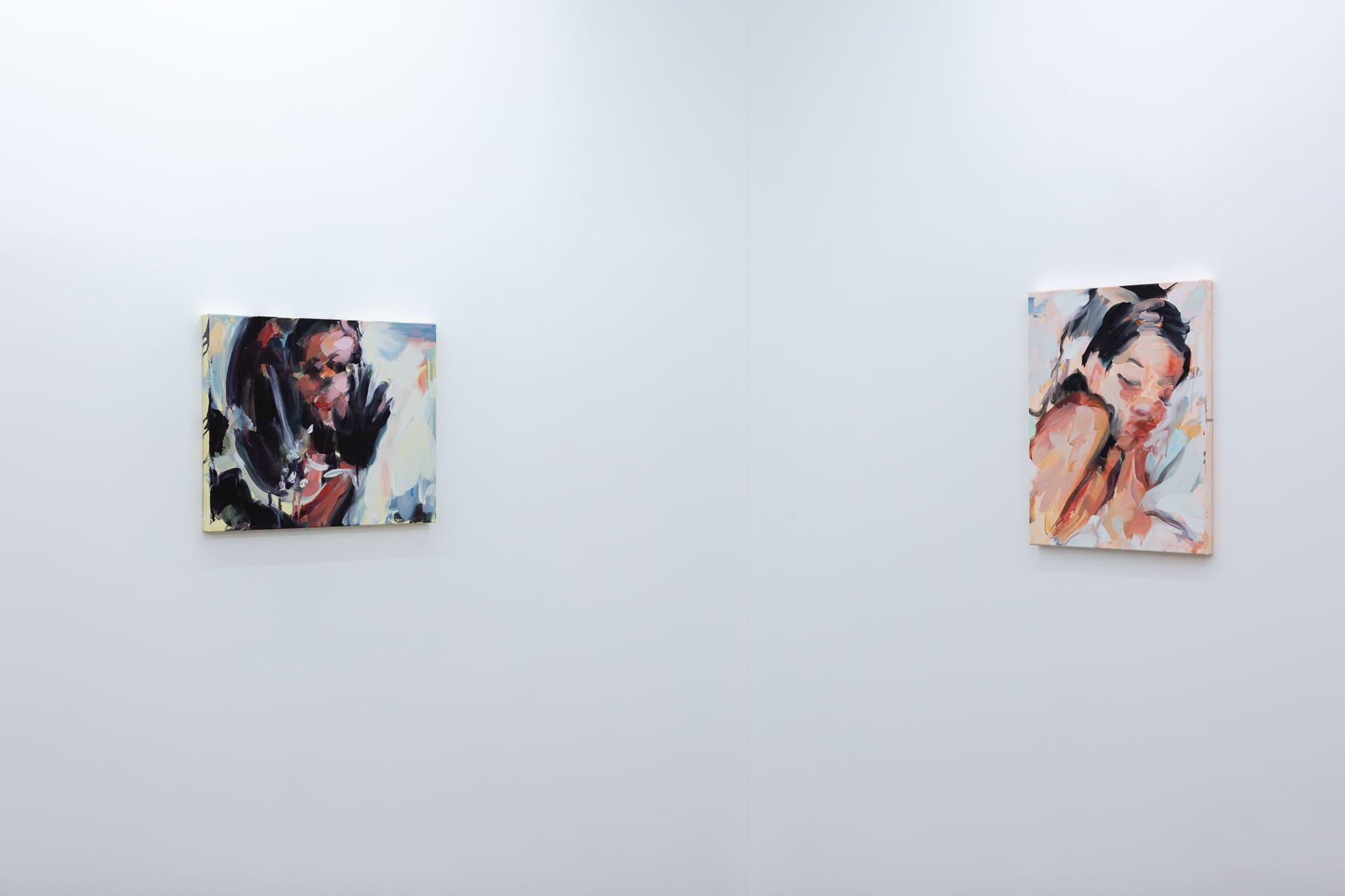 Installation shots of Laura Lancaster's solo show at Workplace London. Close up crop paintings of sleeping women and figures in landscapes, loosely painted.
