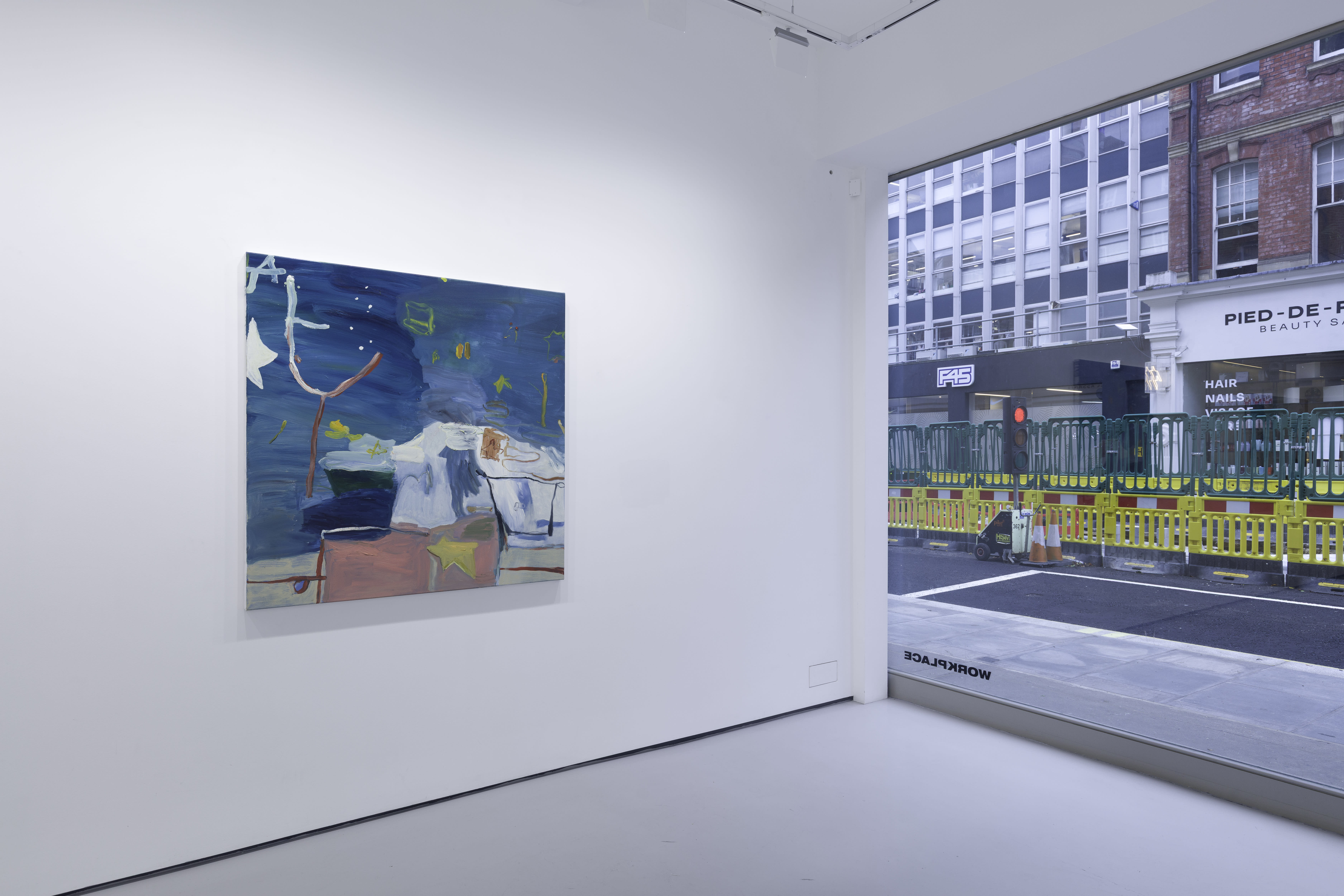 A white walled gallery with 4 artworks by b chehayeb hung on the walls