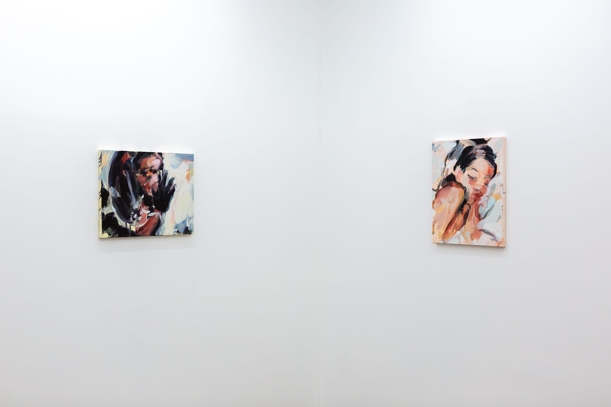 Installation shots of Laura Lancaster's solo show at Workplace London. Close up crop paintings of sleeping women and figures in landscapes, loosely painted.