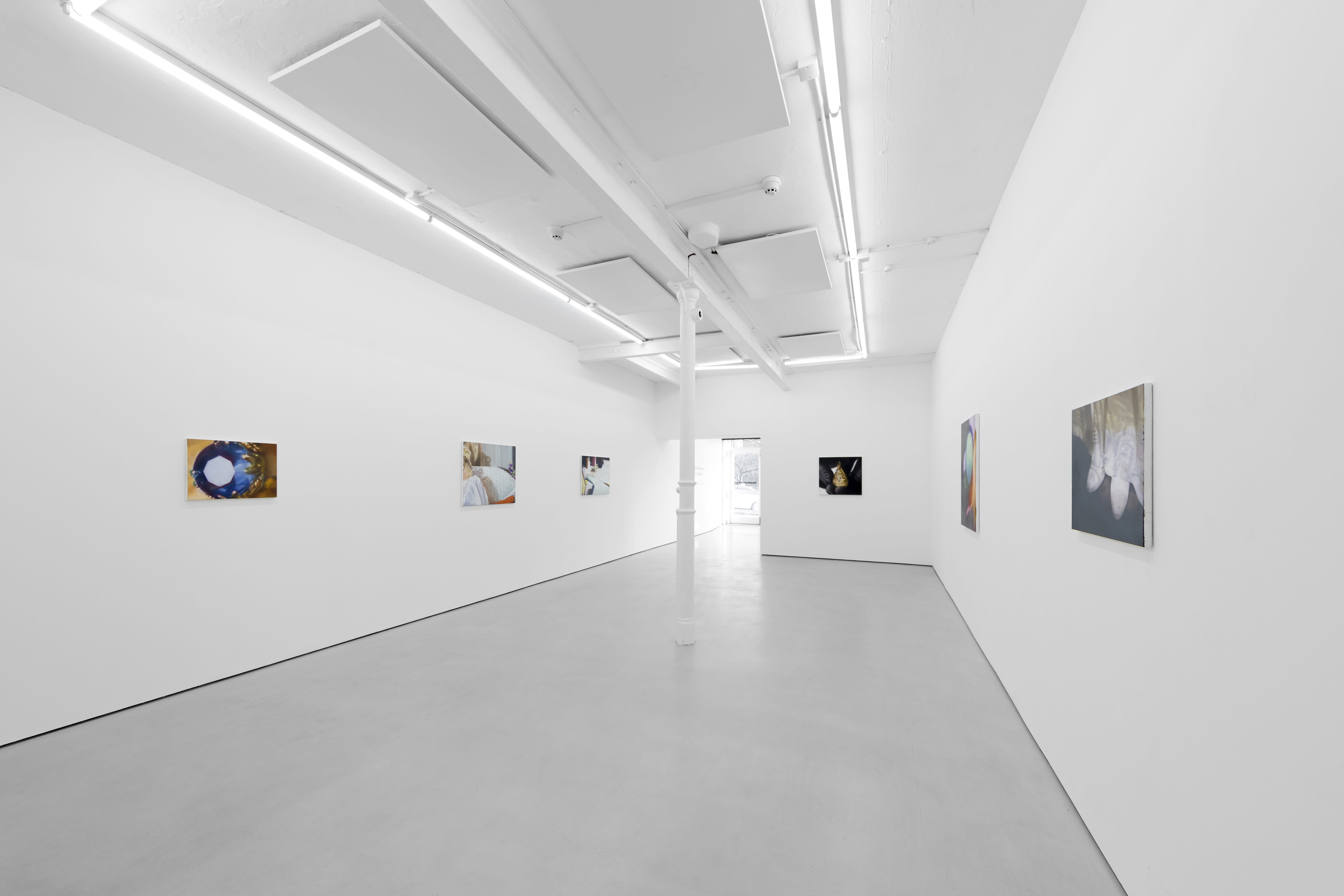 Rachel Lancaster's medium scale oil paintings of domestic objects from cinema are hung in a spacious white gallery space