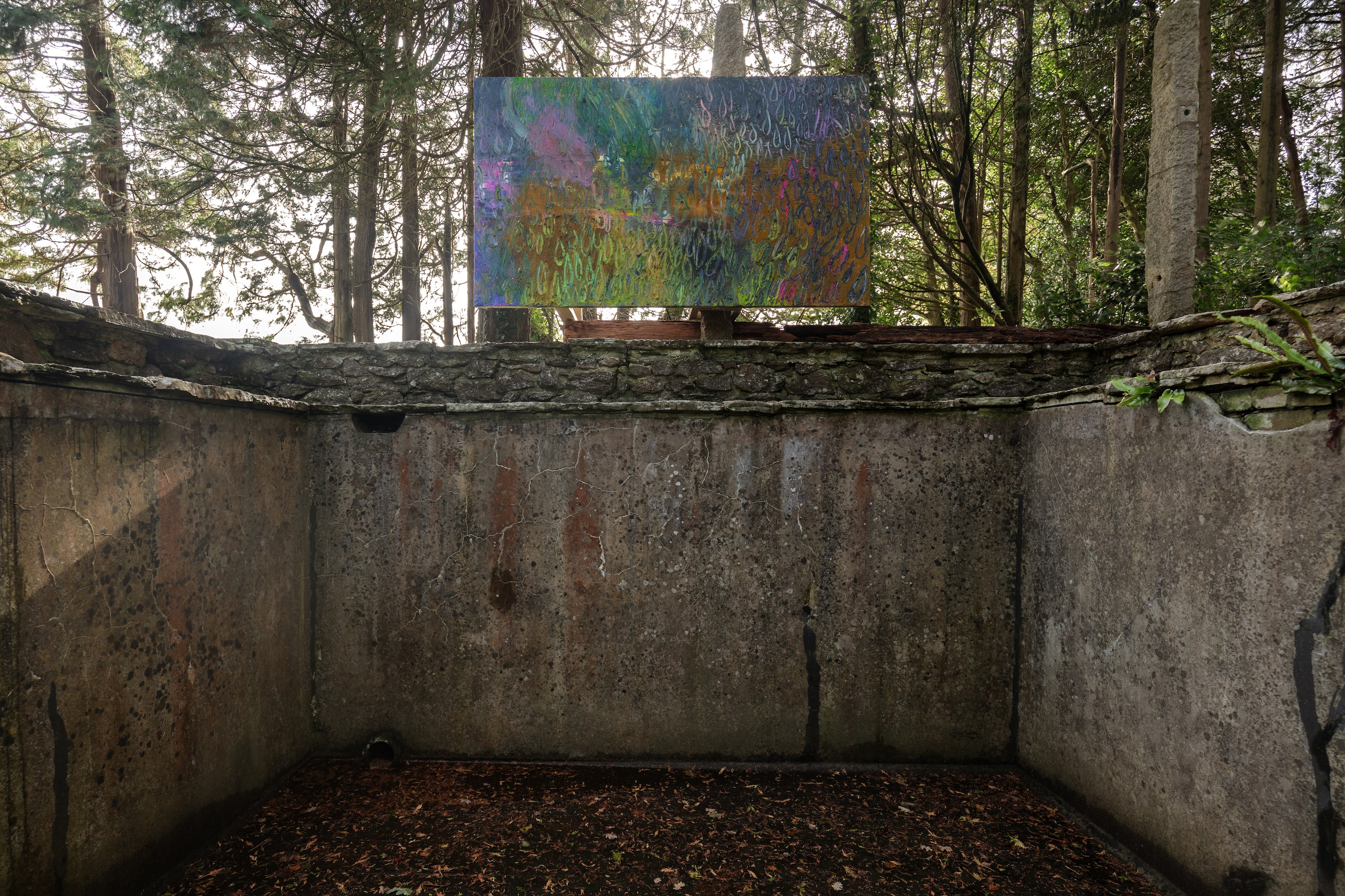 Artworks by James Cabaniuk installed outside in a lush green garden