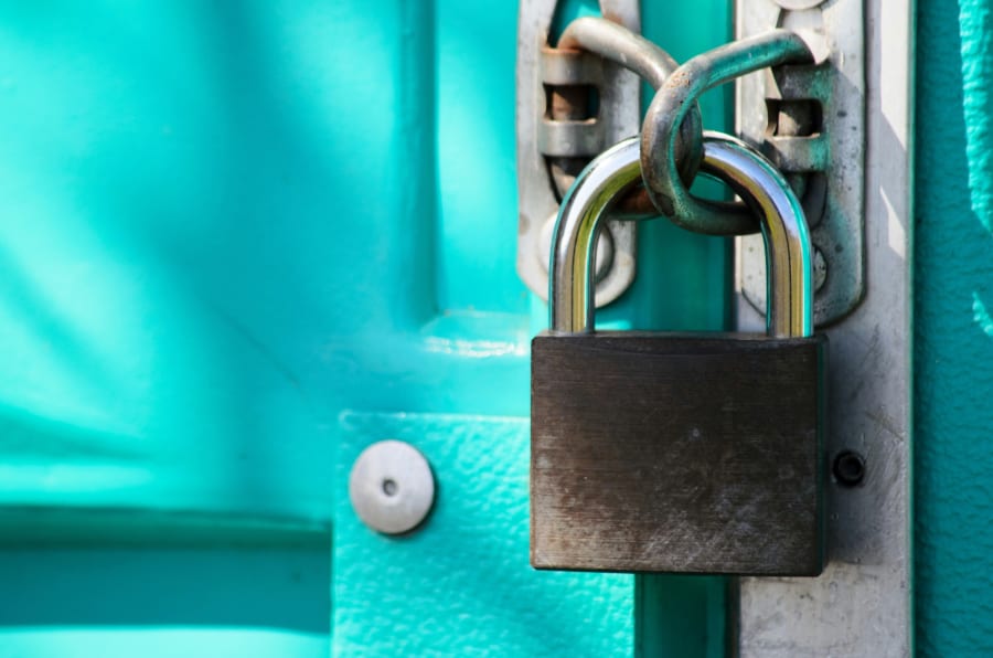 Padlocked door on a Spanish property — symbolising the threat of illegal squatting