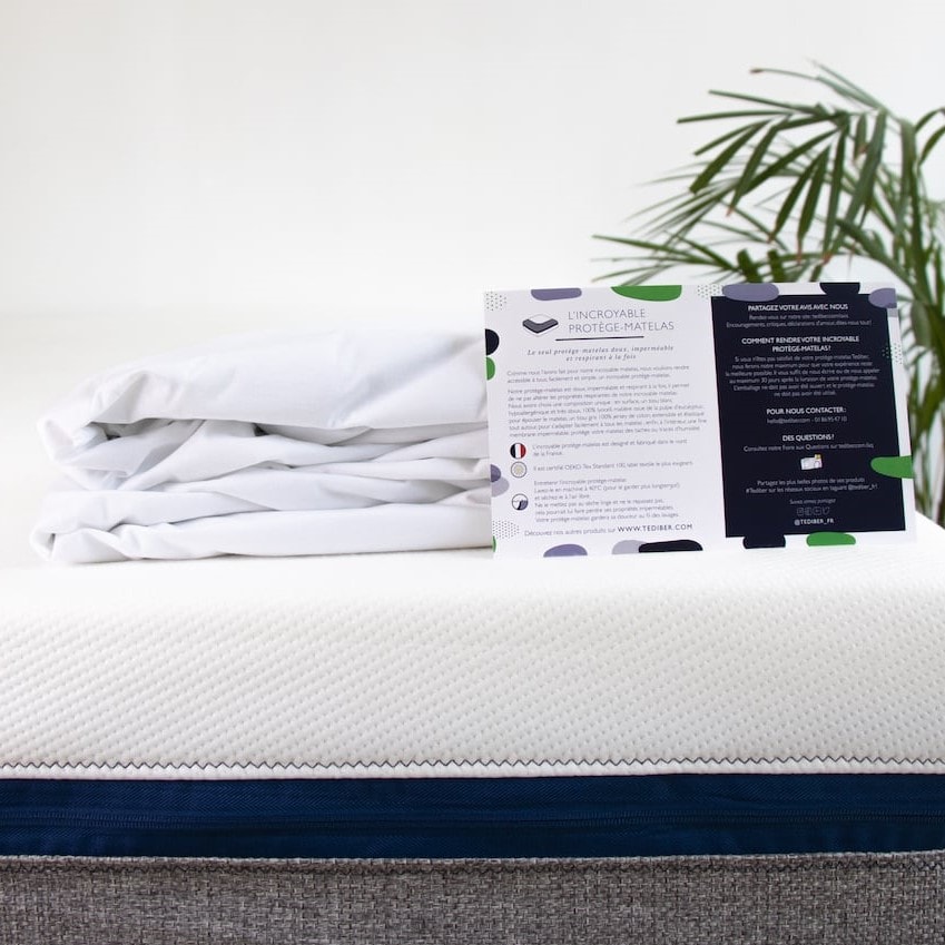 Découvrez le protège-matelas Tediber en tissus haut de gamme : la partie supérieure du protège-matelas (blanche) est 100% lyocell, tissu issu de la pulpe d'eucalyptus. Elle est ainsi hypoallergénique, très douce, respirante et régule bien la température. La partie inférieure du protège-matelas (grise) est en jersey 100% coton, un tissu extensible qui permet de s'adapter facilement au matelas. Membrane est imperméable et silencieuse, elle protège votre matelas des taches ou traces d’humidité. Bonnet de 30 cm. Fabrication française et responsable. Certifié  OEKO-Tex Standard 100. Lavable en machine. 2 ans de garantie pleine