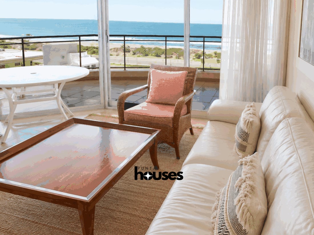 Bright bedroom with large window and Punta del Este city view
