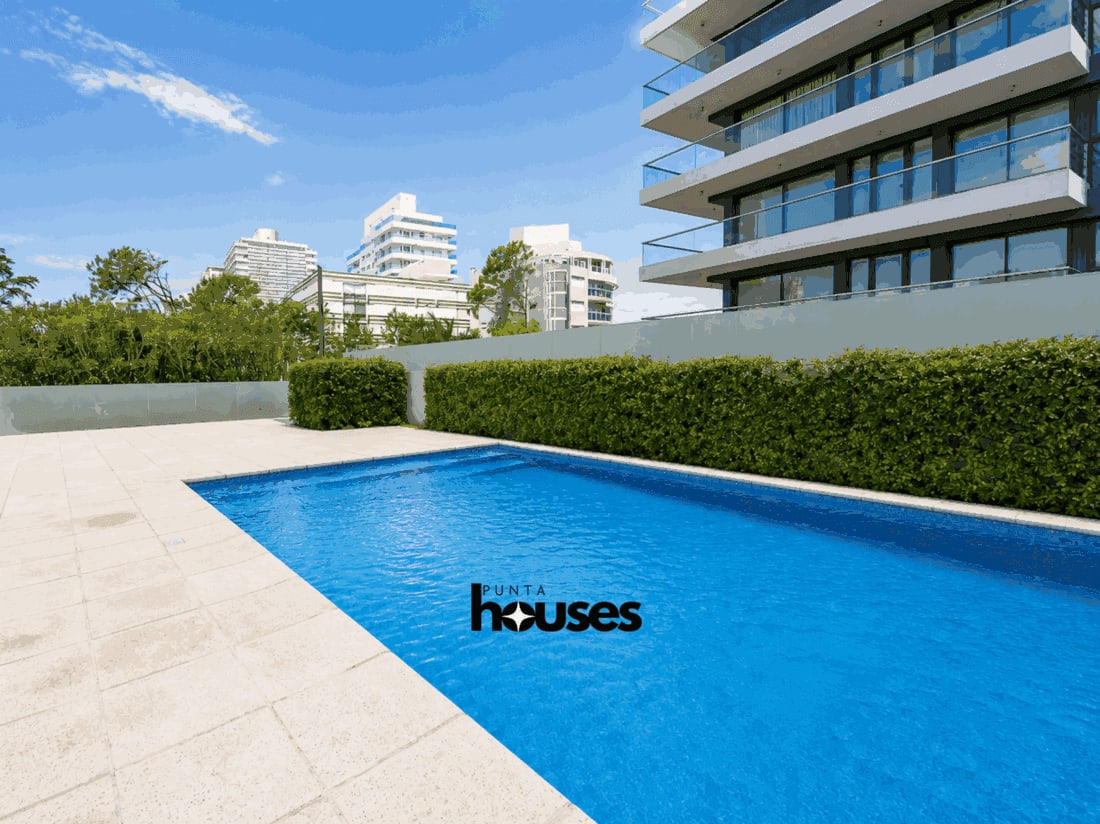 Outdoor swimming pool and modern residential building in Playa Brava
