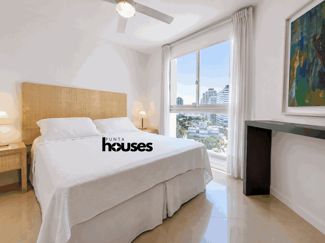 Master bedroom with large windows, terrace and sea view in Punta del Este