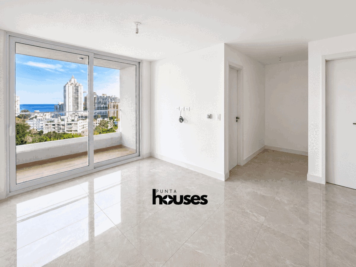 New Punta del Este apartment living room with balcony and sea view near Playa Brava.