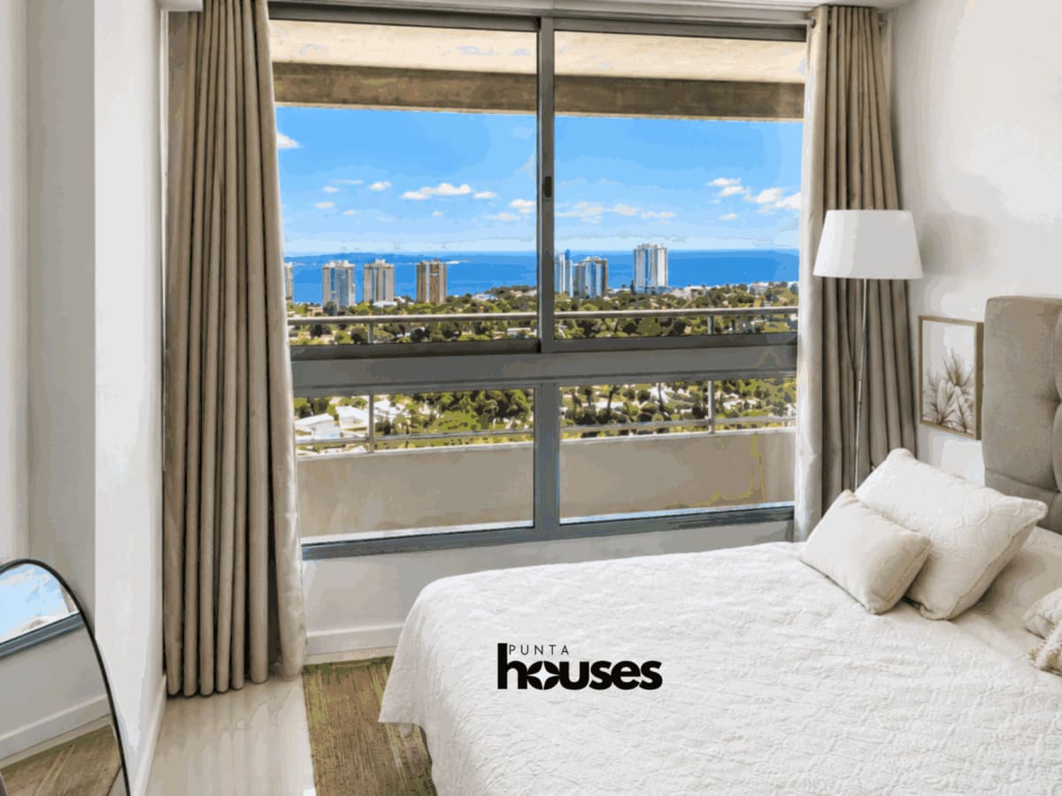 Sea and skyline view from furnished bedroom in one-bedroom apartment near Playa Mansa Punta del Este.
