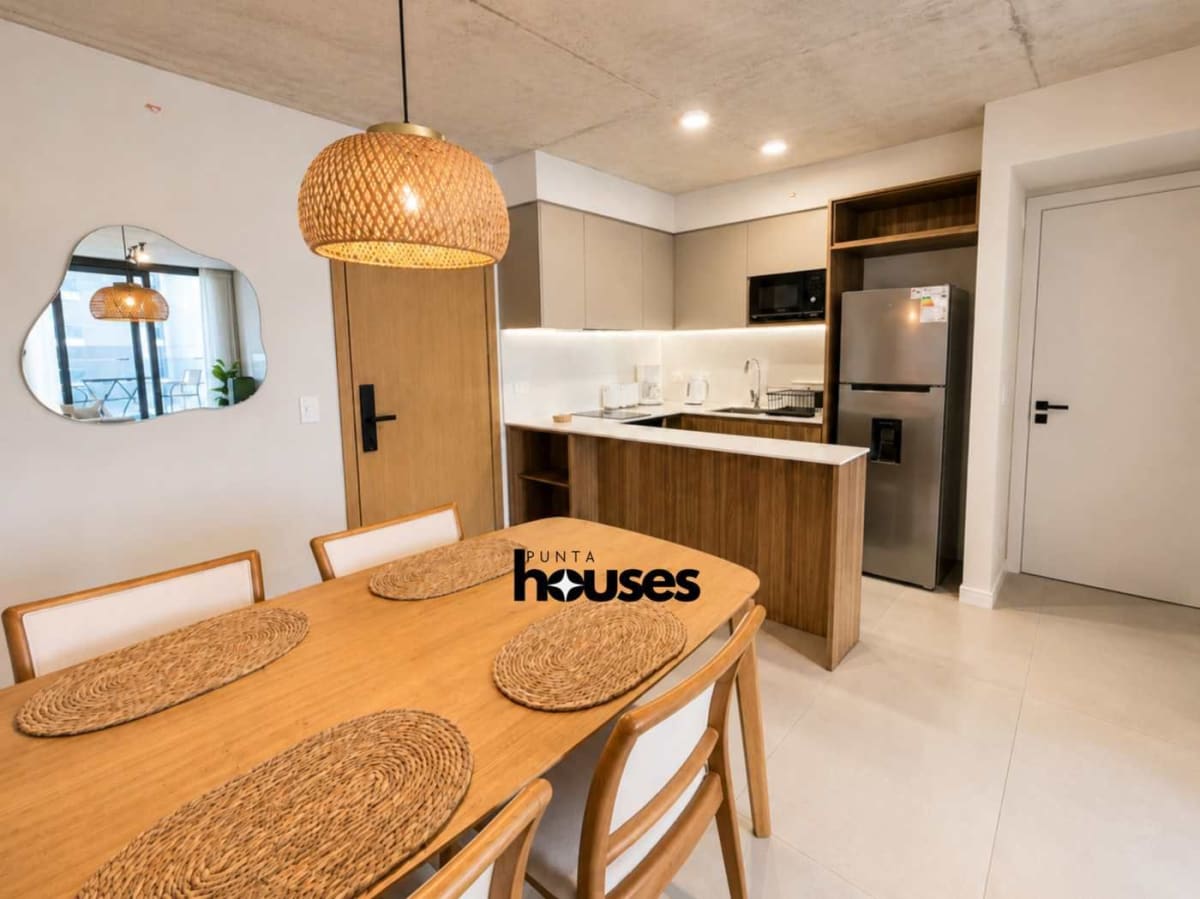 Open-plan kitchen dining and living area in furnished Manglar Brava apartment near Playa Brava Punta del Este.