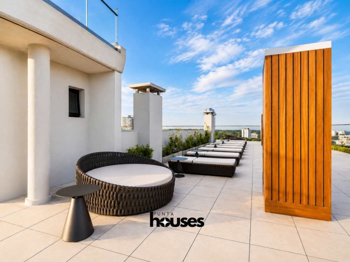 Luxury residents lounge with contemporary furniture and wood finishes at Manglar Brava Punta del Este.