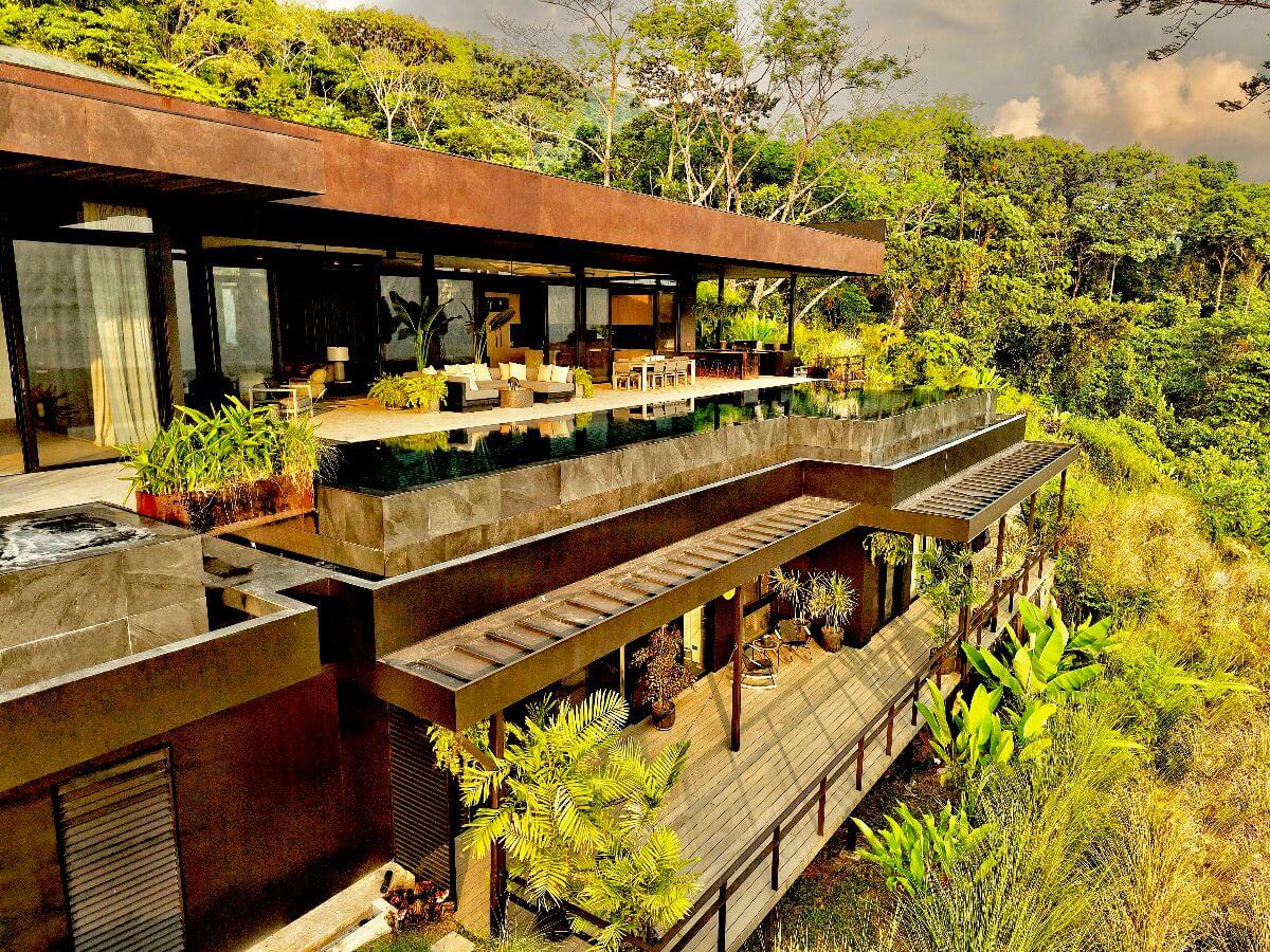 Multi-level luxury estate in Uvita, Costa Rica, featuring terraces, an infinity-edge pool, and lush jungle surroundings.