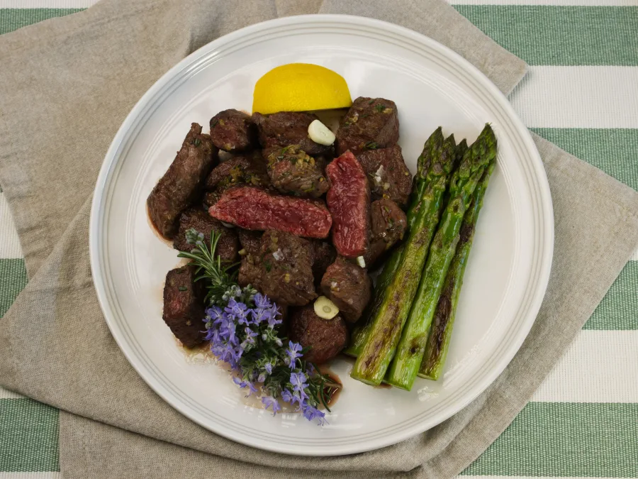 Topdown View of Garlic Butter Denver Steak Bites with Asparagus
