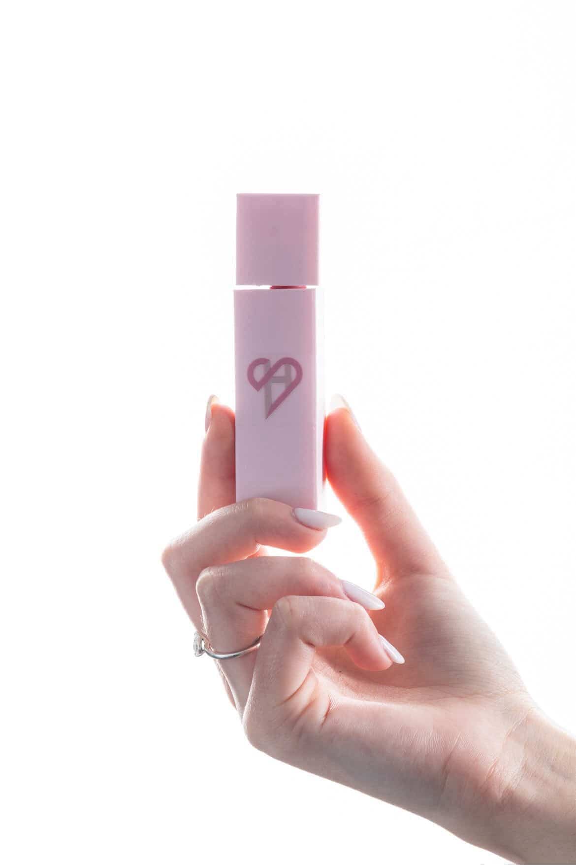 HerShield lip gloss — cap removed showing applicator