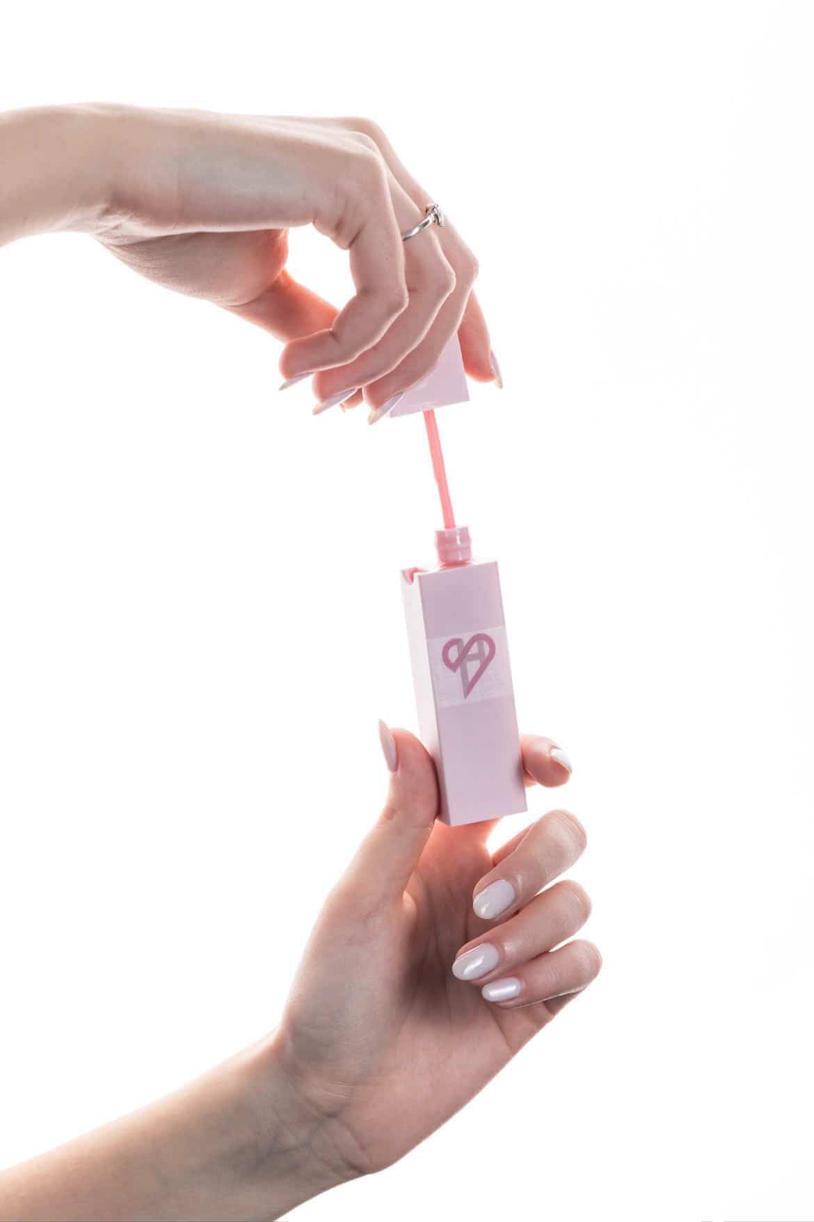 HerShield lip gloss — side compartment detail