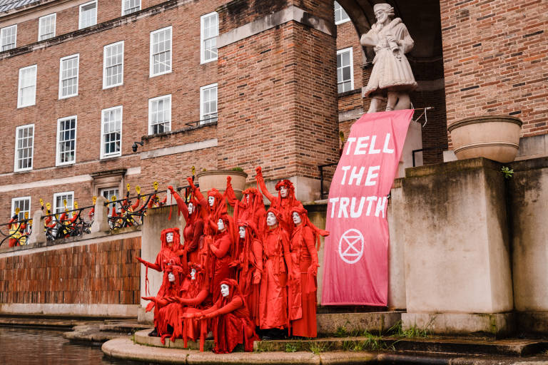 Red Rebel Brigade at a protest against the expansion of Bristol Airport, Bristol, January 2020. Photograph Copyright &copy; Simon Holliday