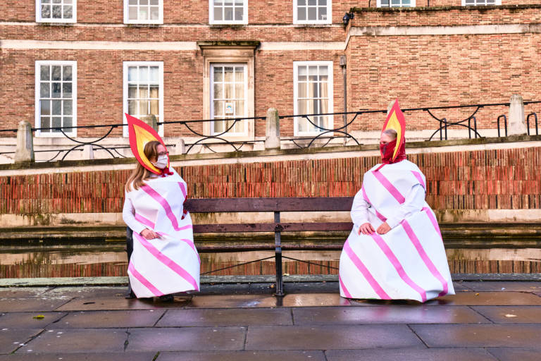Members of Extinction Rebellion dressed as birthday candles after delivering a card and a cake to Bristol City Council to celebrate the second anniversary of their declaration of a Climate Emergency. Bristol, November 2020. Photograph Copyright &copy; Simon Holliday