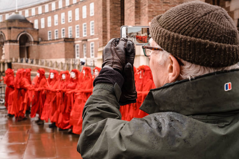 Red Rebel Brigade at a protest against the expansion of Bristol Airport, Bristol, January 2020. Photograph Copyright &copy; Simon Holliday