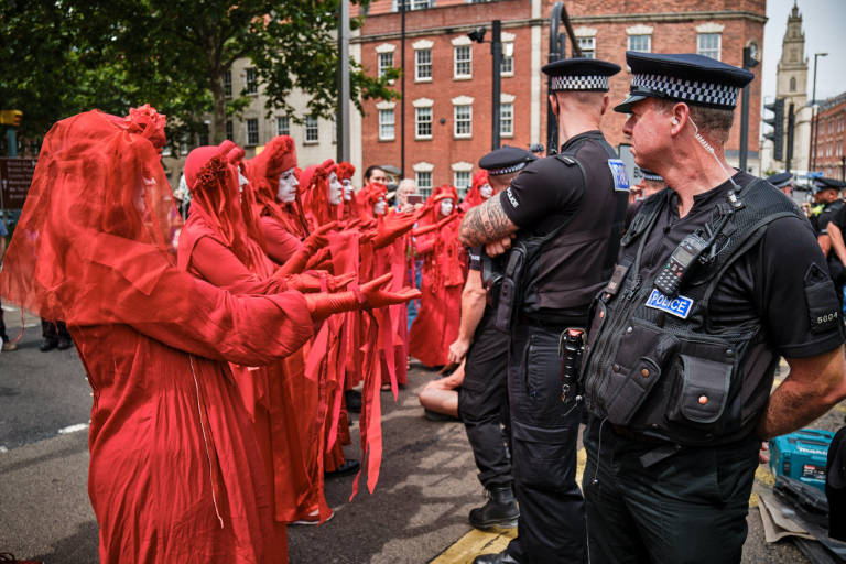 Red Rebel Brigade at an Extinction Rebellion protest, Bristol, July 2019. Photograph Copyright &copy; Simon Holliday