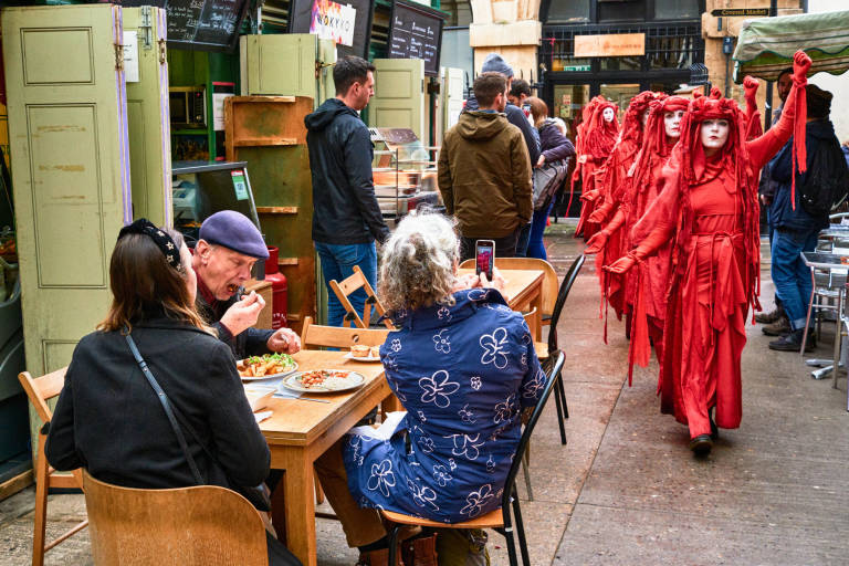Red Rebel Brigade at a protest against the expansion of Bristol Airport, Bristol, January 2020. Photograph Copyright &copy; Simon Holliday