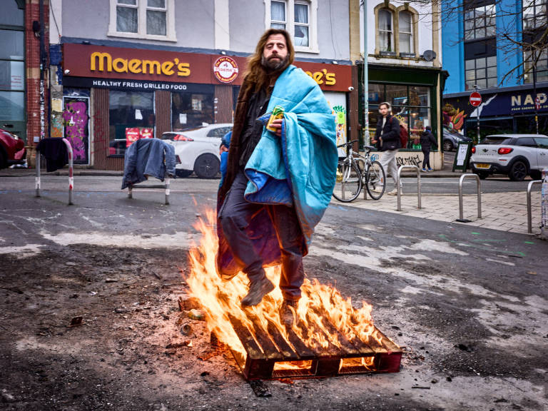 Dennis, keeping warm. Turbo Island, Bristol, February 2024. Photograph Copyright &copy; Simon Holliday