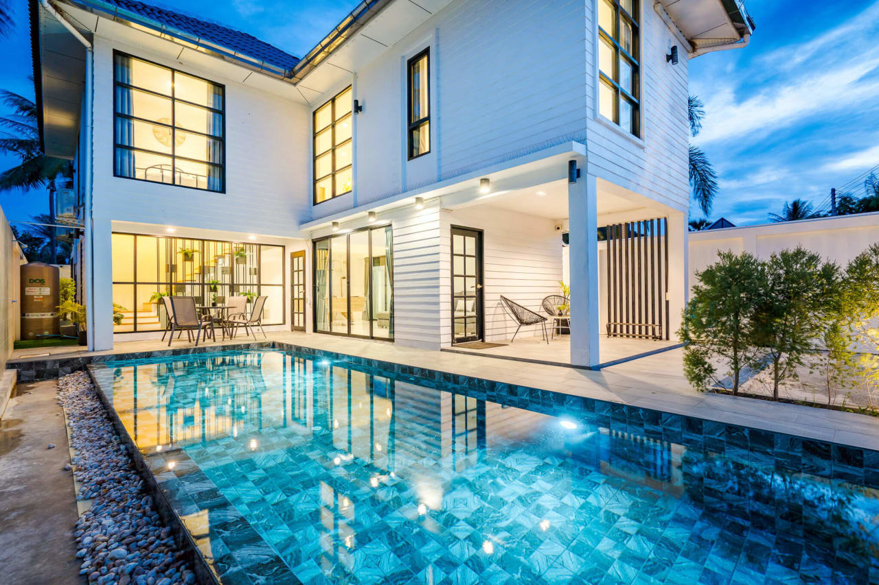 The private saltwater pool at Areeya Retreat, lit up after dark