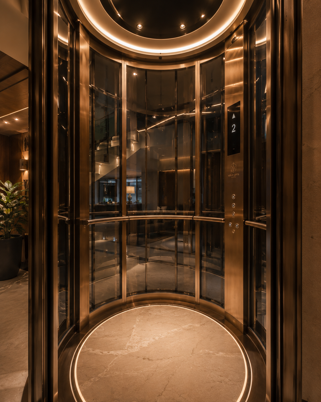 Luxury panoramic elevator interior with bespoke bronze finishes and ambient architectural lighting