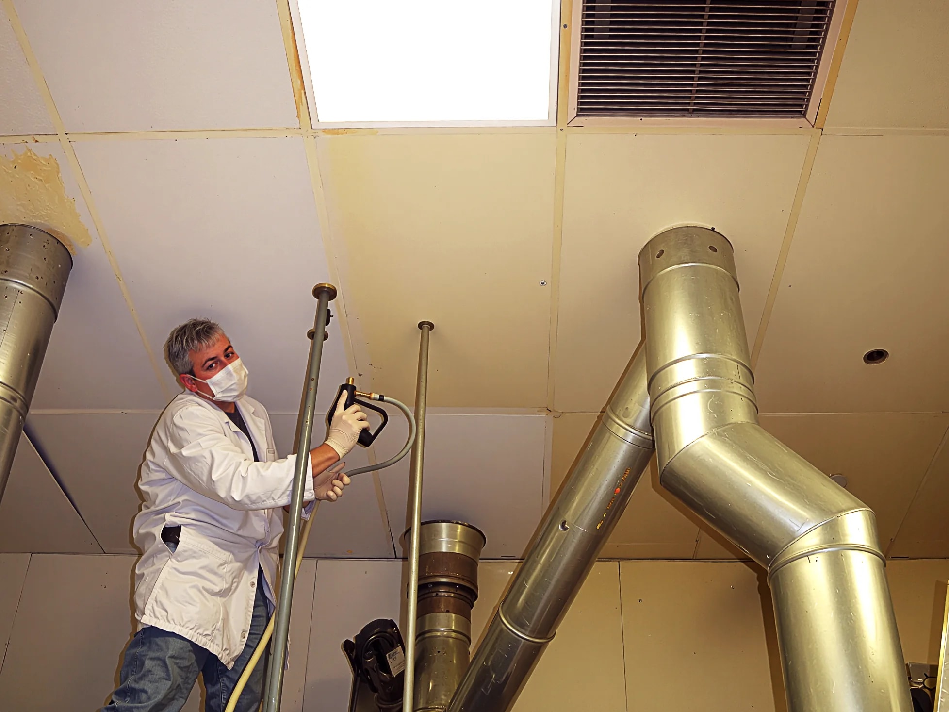 Ceiling cleaning in progress