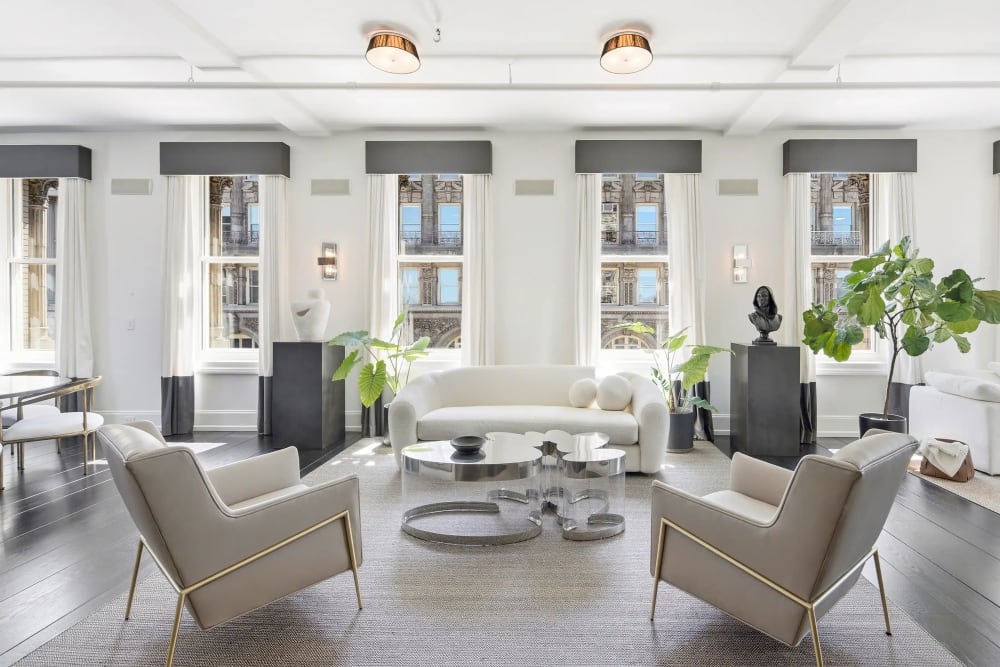 Grand loft sitting room at 158 Mercer Street Unit 10B with soaring ceilings and natural light — a premier SoHo residence