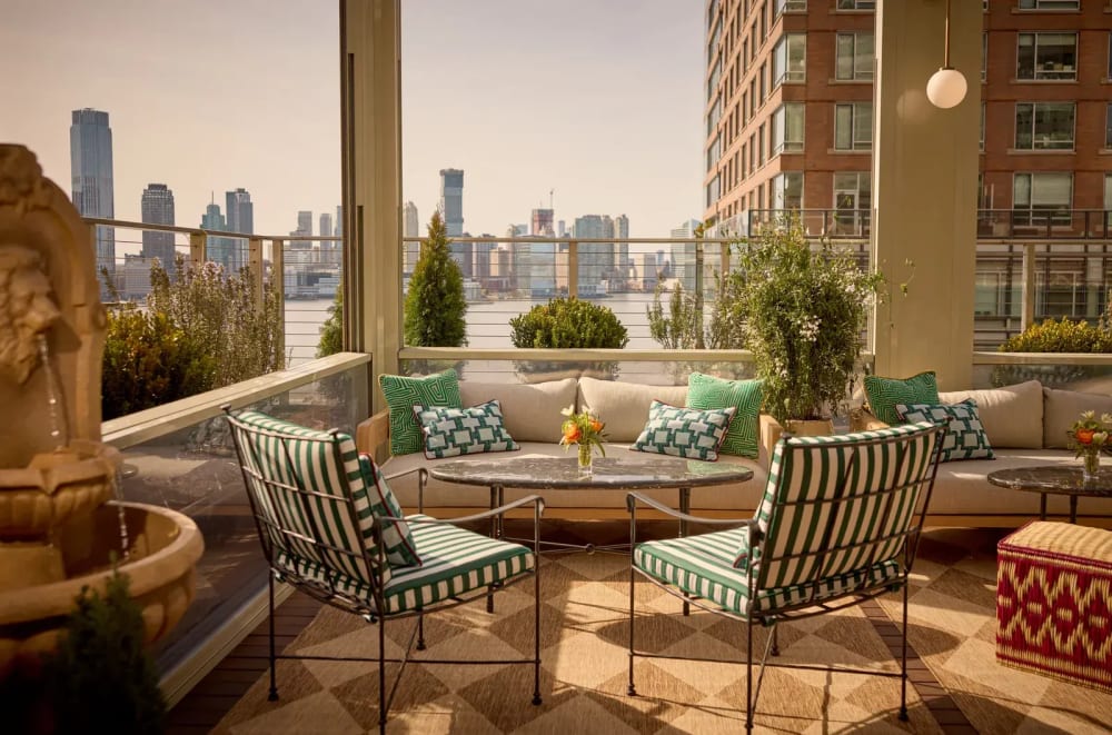 Indoor-outdoor rooftop terrace with retractable glass walls in a NYC luxury residence