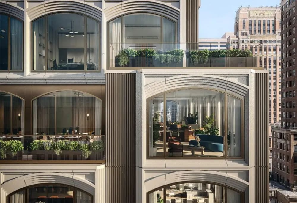 Cast-iron loft building facade on Fifth Avenue in the Flatiron District with tall arched windows