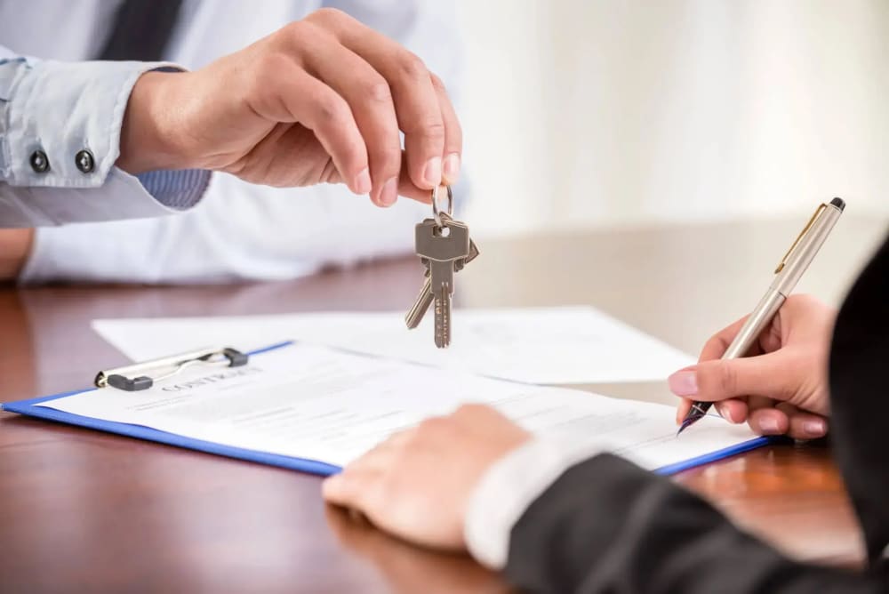 Real estate closing documents and pen on a wooden table in a Manhattan attorney's office