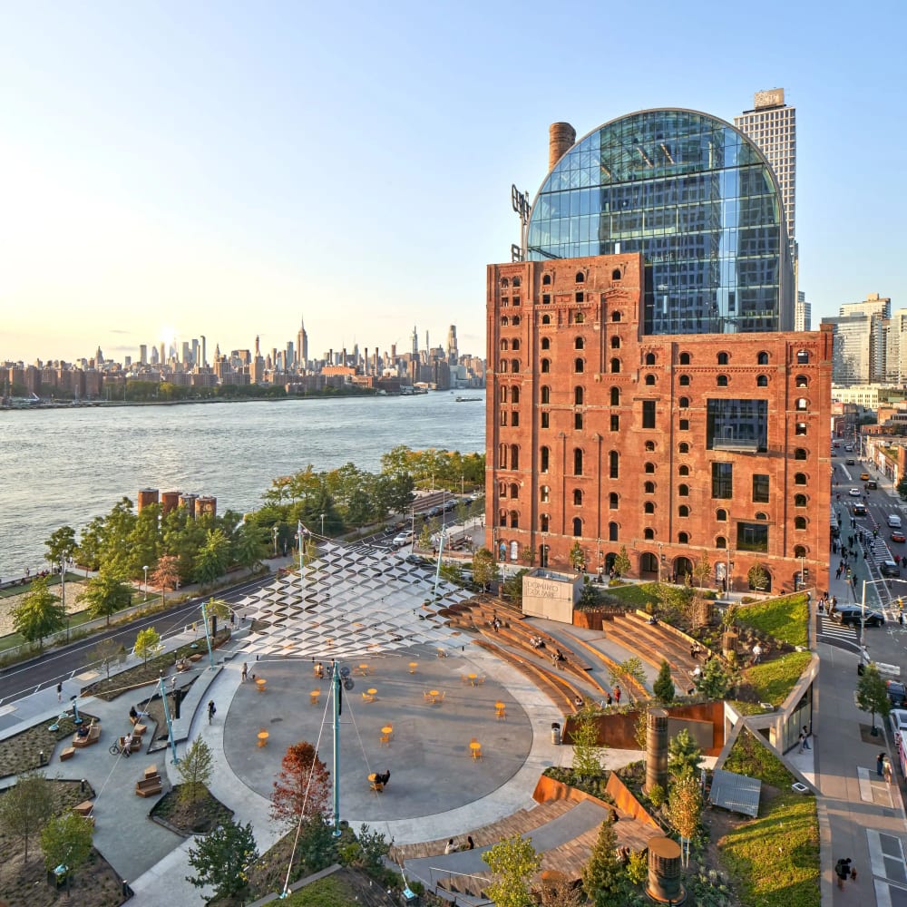 Domino Park's elevated boardwalk and reclaimed sugar refinery equipment overlooking the East River