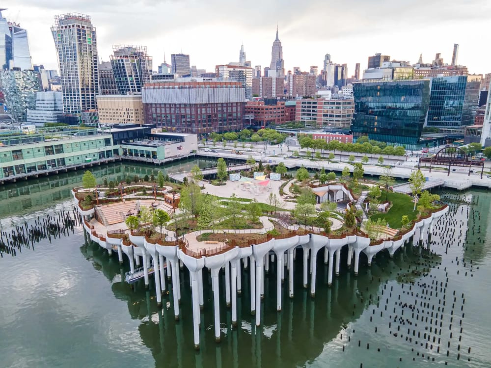 Little Island's sculptural concrete piers and flowering plantings rising from the Hudson River