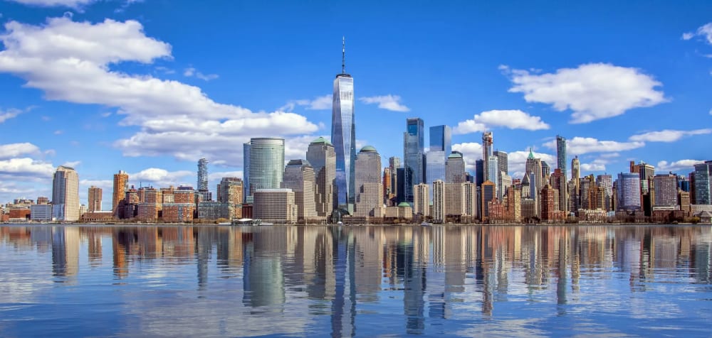 New York City skyline at dusk representing the scale of the city's luxury residential market