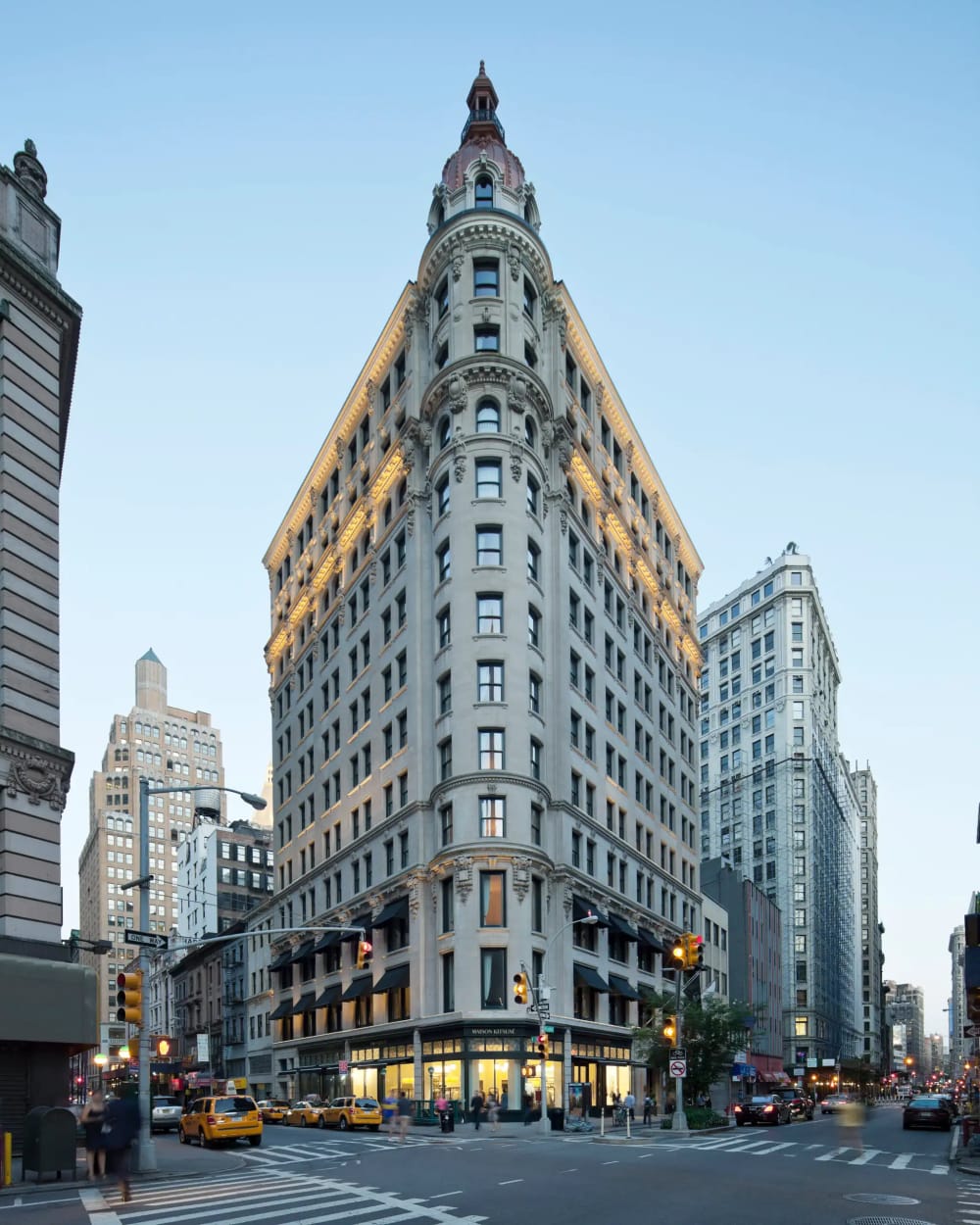 NoMad Hotel and Beaux-Arts loft buildings near Madison Square Park at dusk