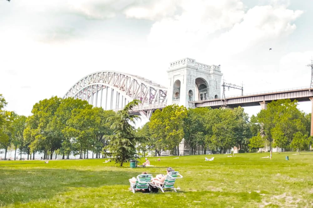 The historic WPA-era public pool at Astoria Park beneath the Hell Gate Bridge