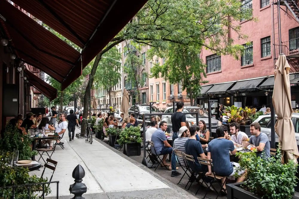 Outdoor dining at a Tribeca restaurant on a charming downtown Manhattan street
