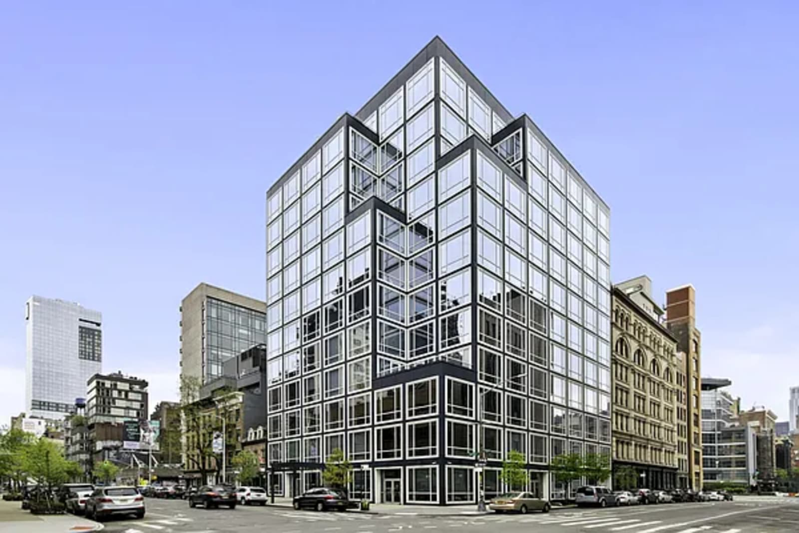 Glass-facade luxury residential tower representative of new construction in NoMad